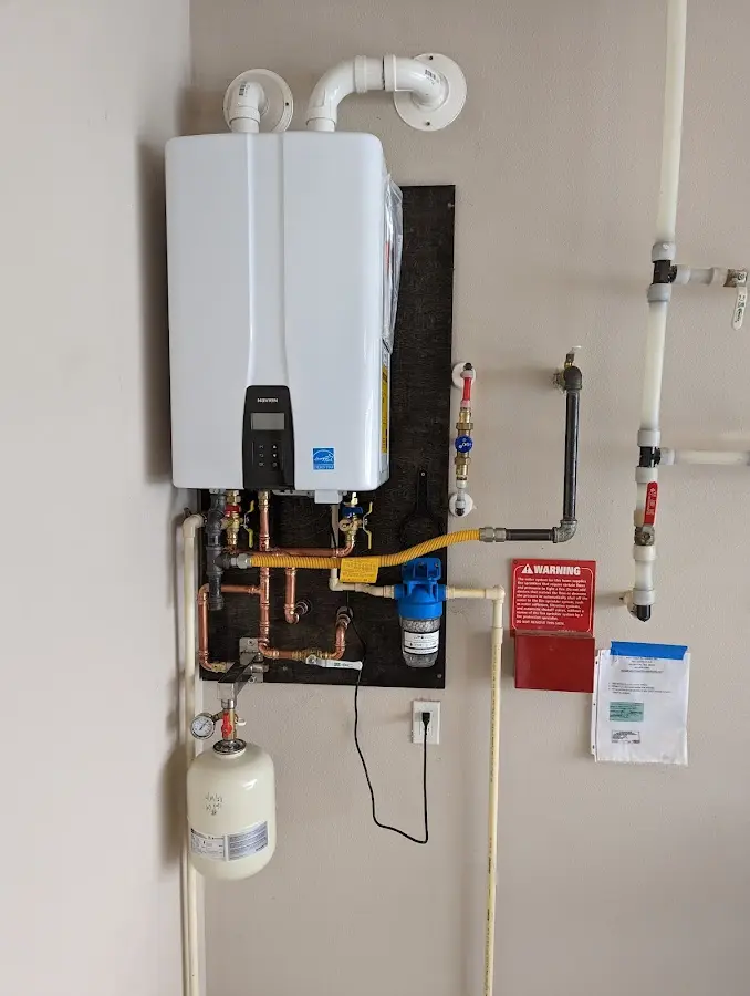 Professional plumber installing copper piping in a Smyrna home